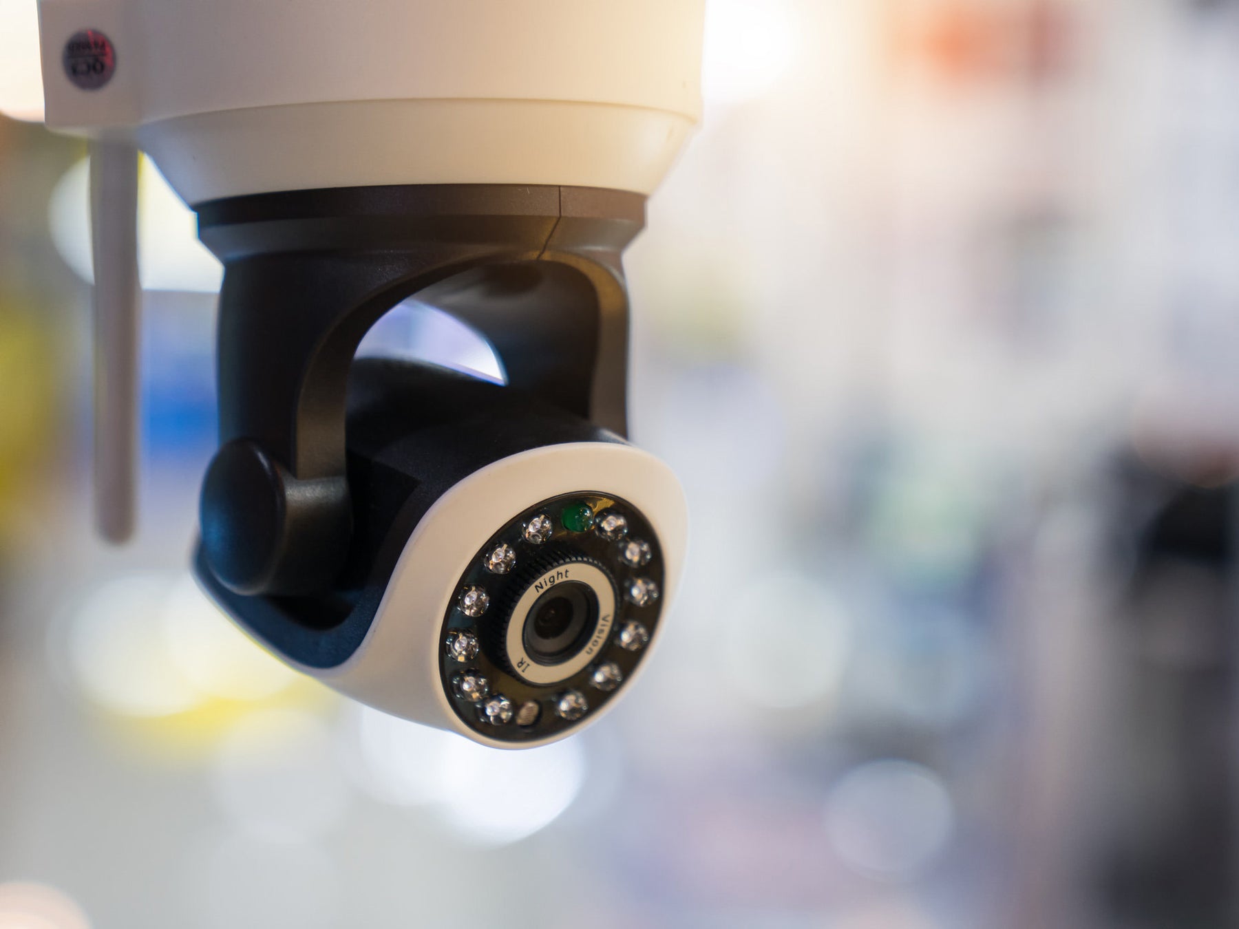 Close-up of a security camera with a blurred background